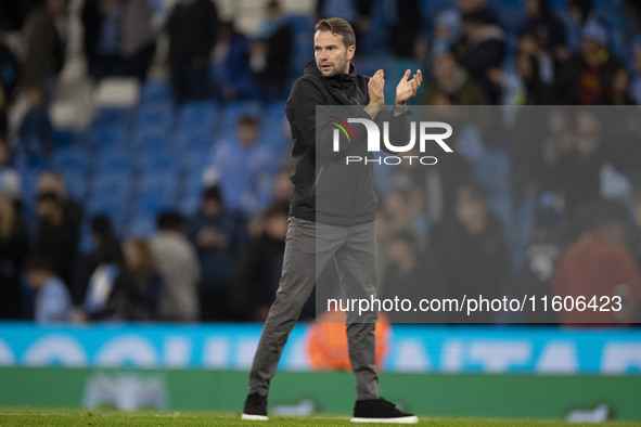 Watford F.C. manager Tom Cleverley applauds at full time during the Carabao Cup Third Round match between Manchester City and Watford at the...