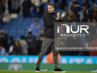 Watford F.C. manager Tom Cleverley applauds at full time during the Carabao Cup Third Round match between Manchester City and Watford at the...