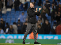 Watford F.C. manager Tom Cleverley applauds at full time during the Carabao Cup Third Round match between Manchester City and Watford at the...