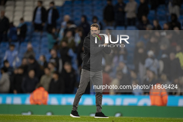 Watford F.C. manager Tom Cleverley applauds at full time during the Carabao Cup Third Round match between Manchester City and Watford at the...