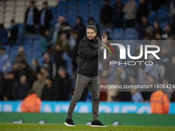 Watford F.C. manager Tom Cleverley applauds at full time during the Carabao Cup Third Round match between Manchester City and Watford at the...