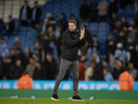 Watford F.C. manager Tom Cleverley applauds at full time during the Carabao Cup Third Round match between Manchester City and Watford at the...