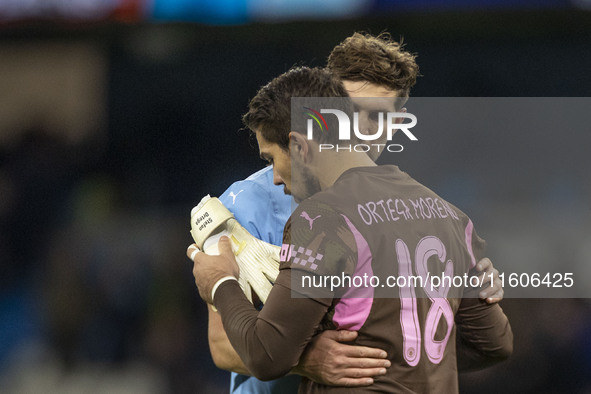 John Stones #5 of Manchester City F.C. and Stefan Ortega #18 (GK) of Manchester City F.C. at full time during the Carabao Cup Third Round ma...