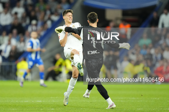 Arda Guler attacking midfield of Real Madrid and Turkey and Antonio Sivera goalkeeper of Alaves and Spain compete for the ball during the La...