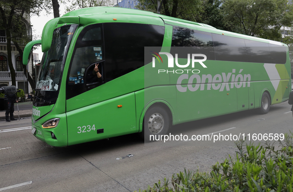 Mothers and fathers of the 43 disappeared students from Ayotzinapa and their companions, on board a bus outside the Senate of the Republic i...