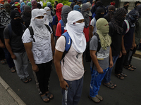 The 43 missing students from Ayotzinapa throw firecrackers on Tuesday, September 24, 2024, and demonstrate outside the Senate of the Republi...