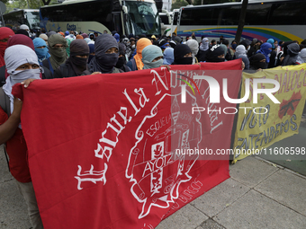 The 43 missing students from Ayotzinapa throw firecrackers on Tuesday, September 24, 2024, and demonstrate outside the Senate of the Republi...