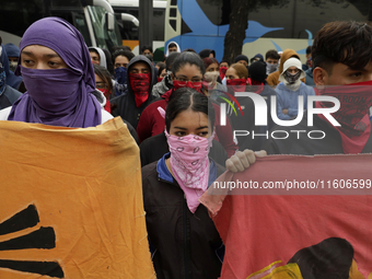 The 43 missing students from Ayotzinapa throw firecrackers on Tuesday, September 24, 2024, and demonstrate outside the Senate of the Republi...