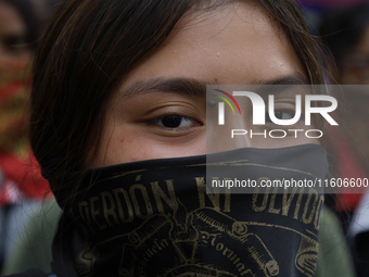 The 43 missing students from Ayotzinapa throw firecrackers on Tuesday, September 24, 2024, and demonstrate outside the Senate of the Republi...