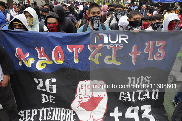 The 43 missing students from Ayotzinapa throw firecrackers on Tuesday, September 24, 2024, and demonstrate outside the Senate of the Republi...