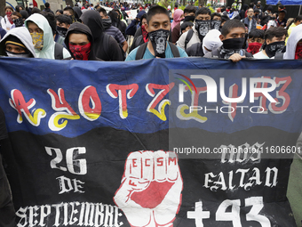 The 43 missing students from Ayotzinapa throw firecrackers on Tuesday, September 24, 2024, and demonstrate outside the Senate of the Republi...