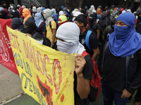 The 43 missing students from Ayotzinapa throw firecrackers on Tuesday, September 24, 2024, and demonstrate outside the Senate of the Republi...