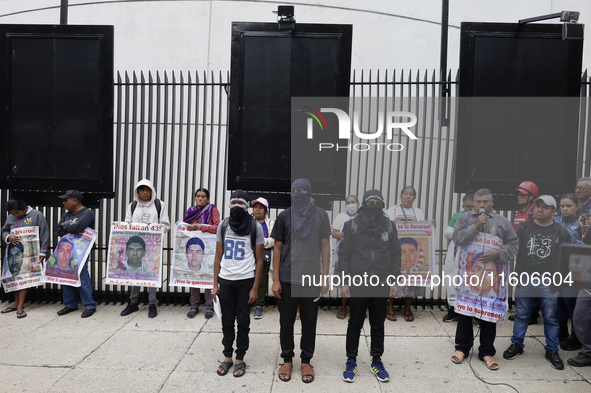 Mothers and fathers of the 43 missing students from Ayotzinapa and their companions demonstrate outside the Senate of the Republic in Mexico...