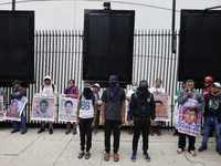 Mothers and fathers of the 43 missing students from Ayotzinapa and their companions demonstrate outside the Senate of the Republic in Mexico...