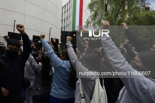 The 43 missing students from Ayotzinapa throw firecrackers on Tuesday, September 24, 2024, and demonstrate outside the Senate of the Republi...