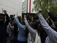 The 43 missing students from Ayotzinapa throw firecrackers on Tuesday, September 24, 2024, and demonstrate outside the Senate of the Republi...