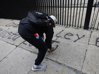 The 43 missing students of Ayotzinapa paint graffiti outside the Senate of the Republic in Mexico City, Mexico, on September 24, 2024, to de...