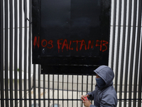 The 43 missing students of Ayotzinapa paint graffiti outside the Senate of the Republic in Mexico City, Mexico, on September 24, 2024, to de...