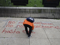 The 43 missing students of Ayotzinapa paint graffiti outside the Senate of the Republic in Mexico City, Mexico, on September 24, 2024, to de...