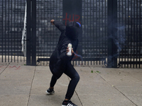 The 43 missing students from Ayotzinapa throw firecrackers at the Senate of the Republic in Mexico City, Mexico, on September 24, 2024, to d...