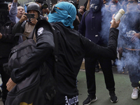 The 43 missing students from Ayotzinapa throw firecrackers at the Senate of the Republic in Mexico City, Mexico, on September 24, 2024, to d...