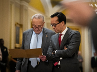 Senate Majority Leader Chuck Schumer (D-NY) confers with an aide while Senate Democrats hold their weekly press conference in  Washington, D...