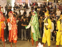 Stilt performers perform for tourists at the ancient town of Xunxian County in Hebi, China, on September 24, 2024. (