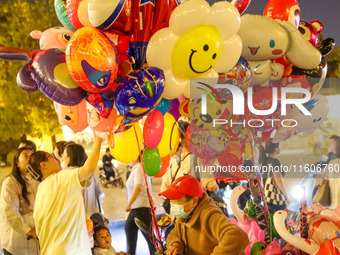 Tourists swarm the ancient city of Xunxian in Hebi, China, on September 24, 2024. (