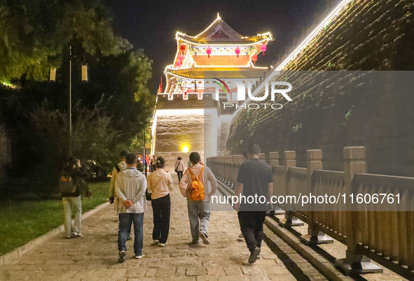 Tourists visit the ancient town of Xunxian in Hebi, China, on September 24, 2024. 