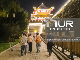 Tourists visit the ancient town of Xunxian in Hebi, China, on September 24, 2024. (