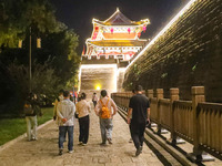 Tourists visit the ancient town of Xunxian in Hebi, China, on September 24, 2024. (