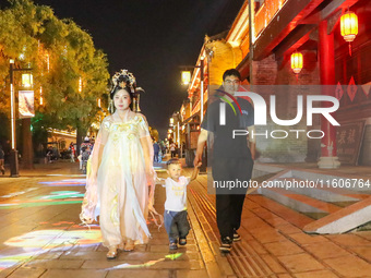 Tourists visit the ancient town of Xunxian in Hebi, China, on September 24, 2024. (