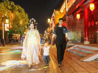 Tourists visit the ancient town of Xunxian in Hebi, China, on September 24, 2024. (