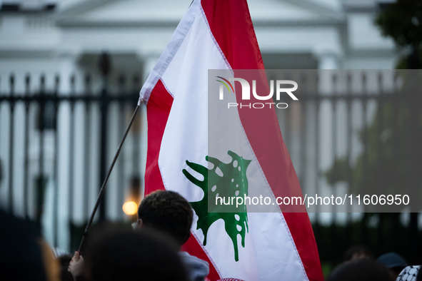 Protesters hold a demonstration in front of the White House in support of Lebanon following extensive air strikes by Israel, in Washington,...