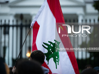 Protesters hold a demonstration in front of the White House in support of Lebanon following extensive air strikes by Israel, in Washington,...