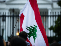 Protesters hold a demonstration in front of the White House in support of Lebanon following extensive air strikes by Israel, in Washington,...