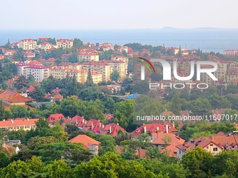 A photo taken on August 30, 2024, shows the distinctive urban buildings in Qingdao, China. On September 24, 2024, the State Council Informat...