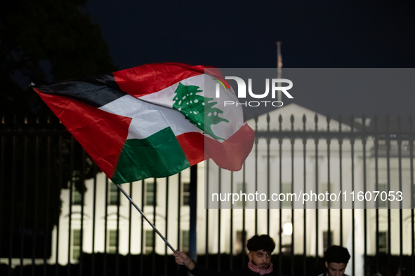 People fly a half Palestinian and half Lebanese flag during a pro-Lebanon demonstration in front of the White House following extensive air...