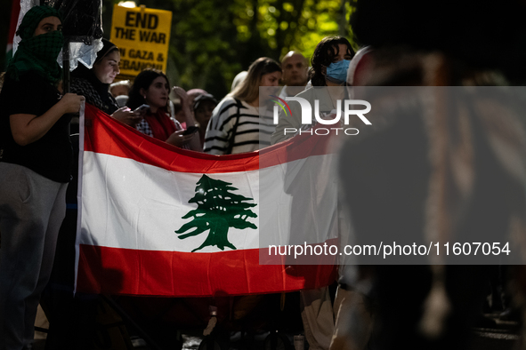 People demonstrate in front of the White House in support of Lebanon, following extensive air strikes by Israel, in Washington, DC, on Septe...