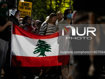 People demonstrate in front of the White House in support of Lebanon, following extensive air strikes by Israel, in Washington, DC, on Septe...