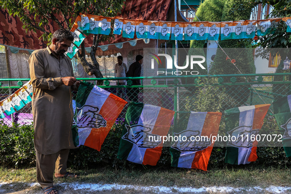 Indian National Congress workers install party flags ahead of Rahul Gandhi's visit to Sopore, Jammu and Kashmir, India, on September 25, 202...