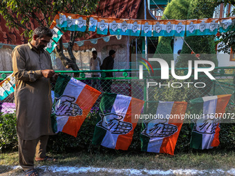 Indian National Congress workers install party flags ahead of Rahul Gandhi's visit to Sopore, Jammu and Kashmir, India, on September 25, 202...