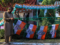 Indian National Congress workers install party flags ahead of Rahul Gandhi's visit to Sopore, Jammu and Kashmir, India, on September 25, 202...