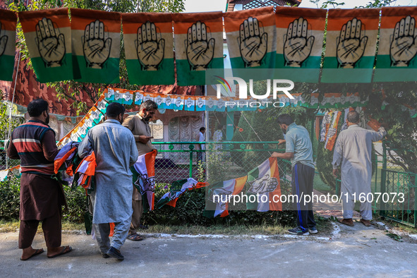 Indian National Congress workers install party flags ahead of Rahul Gandhi's visit to Sopore, Jammu and Kashmir, India, on September 25, 202...