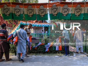 Indian National Congress workers install party flags ahead of Rahul Gandhi's visit to Sopore, Jammu and Kashmir, India, on September 25, 202...