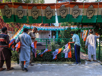 Indian National Congress workers install party flags ahead of Rahul Gandhi's visit to Sopore, Jammu and Kashmir, India, on September 25, 202...