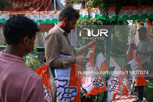 Indian National Congress workers install party flags ahead of Rahul Gandhi's visit to Sopore, Jammu and Kashmir, India, on September 25, 202...