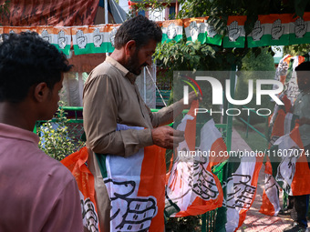 Indian National Congress workers install party flags ahead of Rahul Gandhi's visit to Sopore, Jammu and Kashmir, India, on September 25, 202...