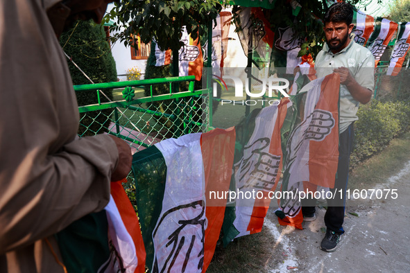 Indian National Congress workers install party flags ahead of Rahul Gandhi's visit to Sopore, Jammu and Kashmir, India, on September 25, 202...