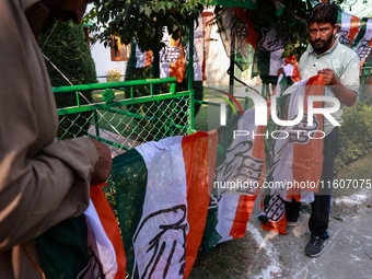 Indian National Congress workers install party flags ahead of Rahul Gandhi's visit to Sopore, Jammu and Kashmir, India, on September 25, 202...